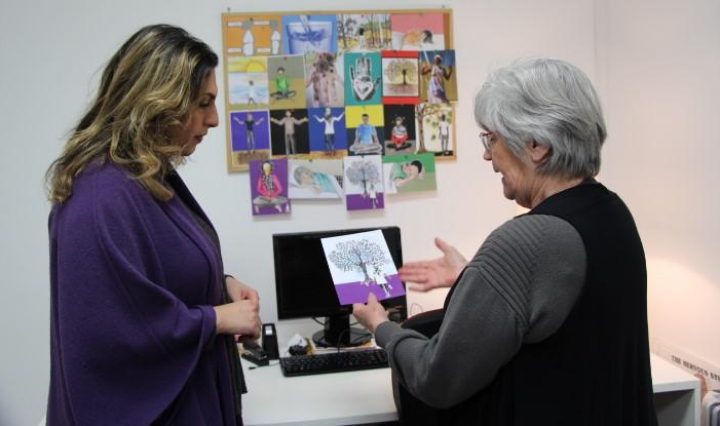 Lyn showing Nasim the new self care cards